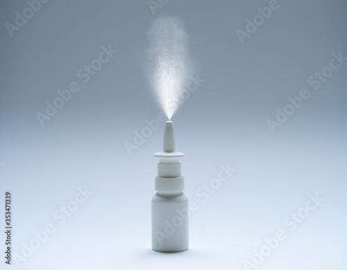 Blank Nasal Spray in Action on Monochrome Background, Minimalistic Style. Healthcare and Medicine. Copy Space. Empty Space