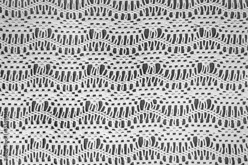 old-fashioned crochet lace zigzag pattern on dark gray background