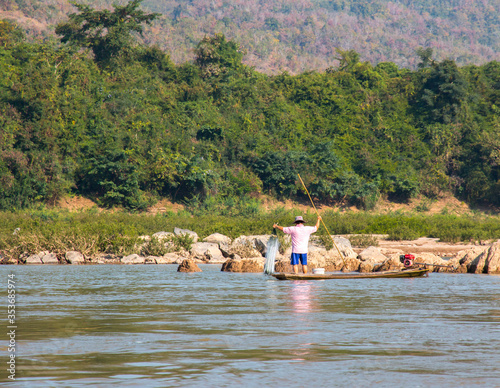  fisherman boat on mekong river, Laos