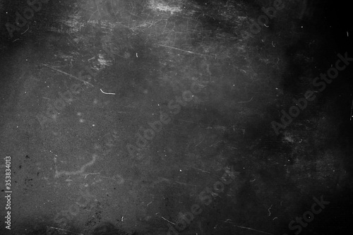 Dark grunge scratched background, distressed chalkboard texture, old film effect