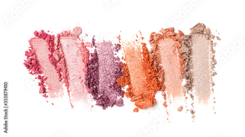 Close-up of make-up swatches. Smears of crushed shiny color eye shadow with brush