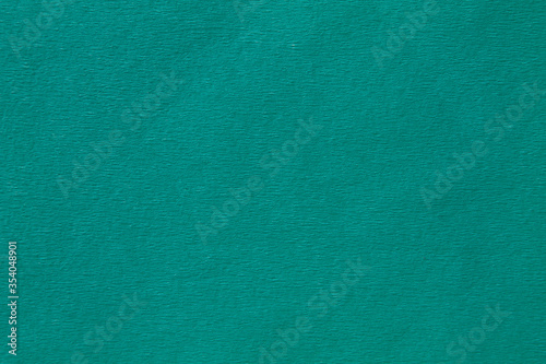 background from turquoise color crepe paper close up