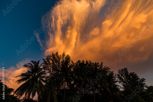 Beautiful sunset over Malaysian island Perhentian Besar with red clouds