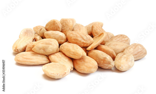 Pile of blanched almonds isolated on white background. Delicious diet food
