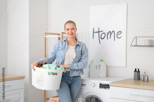 Young woman doing laundry at home