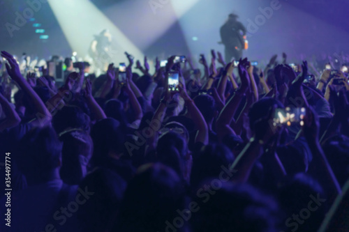 blur of People shooting video or photo in music brand showing on stage or Concert Live, party concept