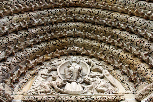 Closeup of Porta Coeli Monastery tympanum decorated with reliefs, sculptures, floral motives. Queen and king donating the monastery to Jesus. Part of western portal, Predklasteri,Czech Republic,Europe