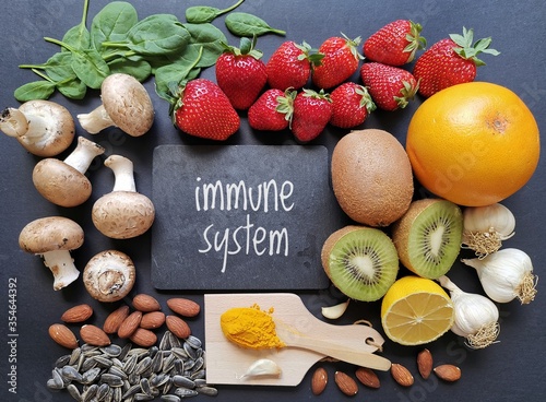 Assortment of food to naturally boost immune system. Immune-boosting foods. Concept of helpful ways to strengthen immunity naturally.