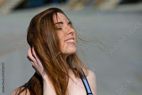 A close up of attractive young woman running