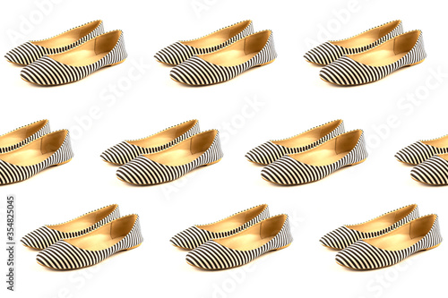 A set of variations of angles of women's summer shoes made of fabric in white and blue stripes, ballet flats isolated on a white background. The concept of women's shoes. Banner