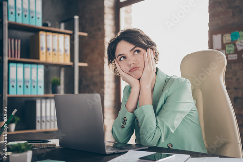 Photo of pretty business lady hold arms cheekbones look up minded notebook table insurance agent home remote online work lazy bored formalwear blazer sit chair modern office indoors