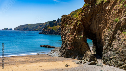 Cliffs, beach and rocks sunny day in sark