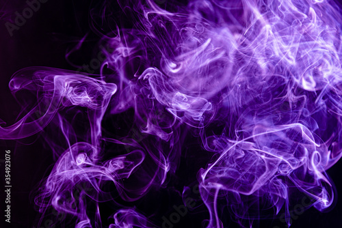 Purple abstract shaped smoke against black background.