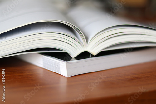 Books, Thick heavy books with white paper and hard cover, good binding, perfect binding, large number of pages, huge page booklet on table