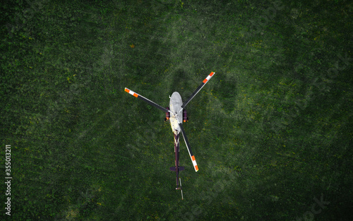 helicopter on the green grass photographed from the air