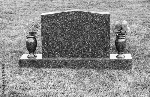 Large blank tombstone in a cemetery