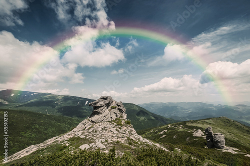 Amazing Rainbow in Summer Mountains