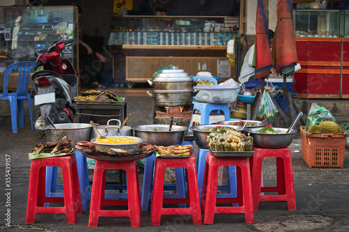 Asian fresh street food on the chairs in Cambodia