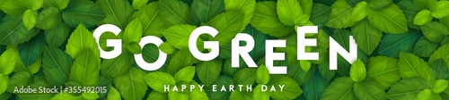 Vertical ecology theme banner template with realistic leaves and go green lettering. Vector illustration. Happy earth day