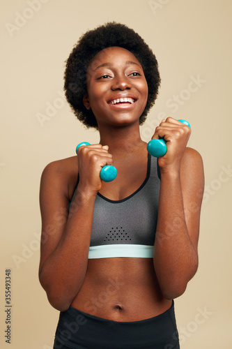 Workout. Fitness Girl With Dumbbells Portrait. Smiling African Woman Exercising And Looking Away. Sport For Natural Beauty.