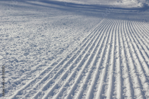 Snow texture with traces of ratrac machine