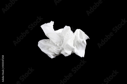  Crumpled paper napkin isolated on black background