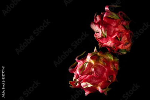 close-up of dragon fruits on a black background