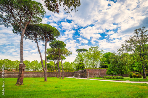 Park with trees near the historic city walls in Lucca, Italy, Europe.