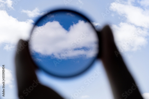 hand holds a circular polarizer filter Accessory for the photographer