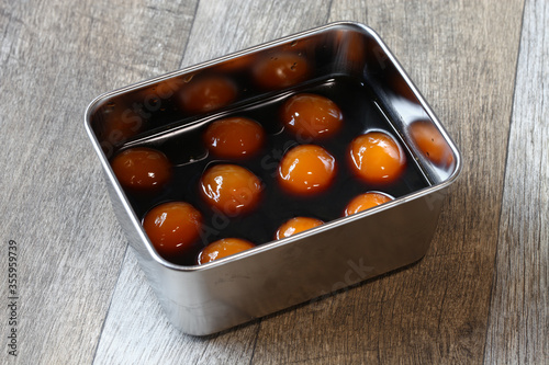 making egg yolks marinated in soy sauce, japanese nibble food