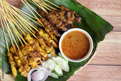 Satay is a popular Malaysia / Indonesia dish of seasoned, skewered and grilled chicken and meat, served with peanut sauce. 