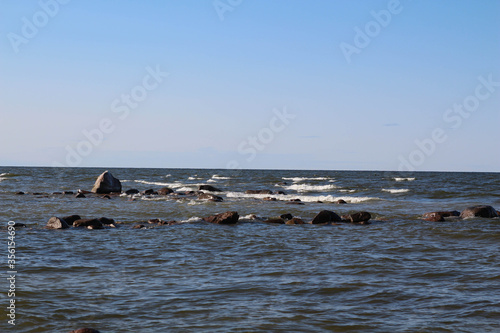 Baltic sea at Mersrags, Latvia, Europe. on the coast of Baltic sea. Many types of landscape can be seen, seaside, blue sky. Stoun, way in sea.