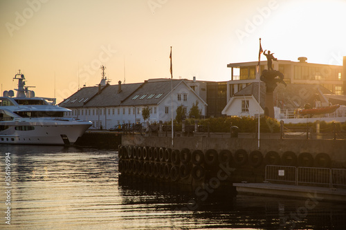 Gdansk, Poland - Juny, 2019: Scenic secessionist houses in european Alesund town reflected in water at Romsdal region in Norway