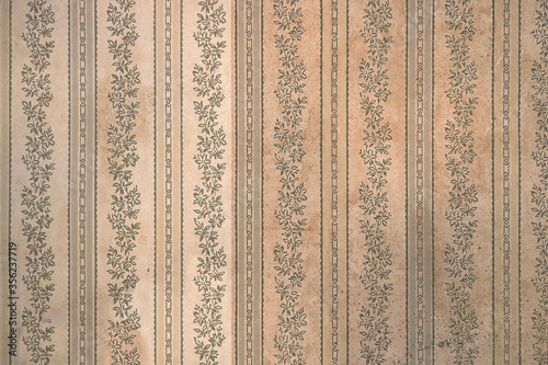 vintage decorative wall paper surface with a floral pattern from ancient texture of an old house interior - victorian background wallpaper