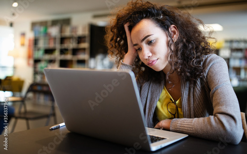 Student woman finding it difficult at study and comprehend scool tasks