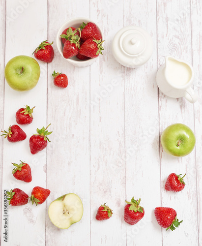 Detox concept. Tasty fruits and berries. Healthly food. Veganism, vegetarianism, raw food diet. Strawberries and apples. Summer fresh fruits. Copy space. Vitamins in food. Healthy breakfast 