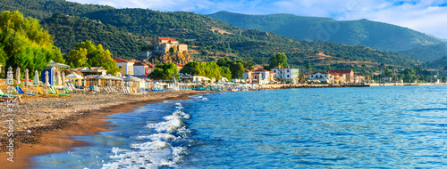 Lesvos island . Greece. Beautiful coastal village Petra with famous monastery over the rock and great beach