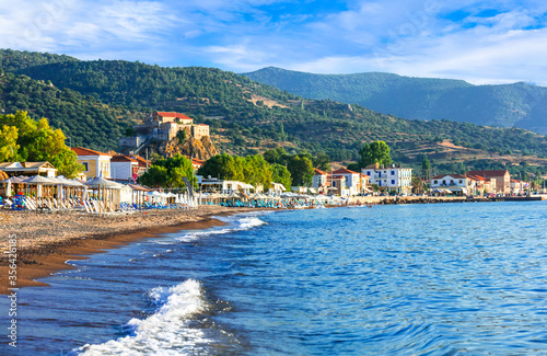 Lesvos (lesbos) island . Greece. Beautiful coastal village Petra with famous monastery over the rock and great beach