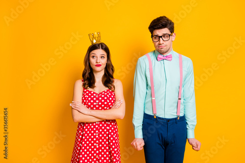 Photo of pretty lady handsome shy freak guy afraid ask queen girl go to prom boast selfish person wear red dotted dress shirt bowtie pants isolated yellow bright color background