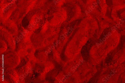 Closeup image of beautiful red sand grains with patterns for background.