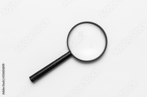 search magnifying glass on a white craft background