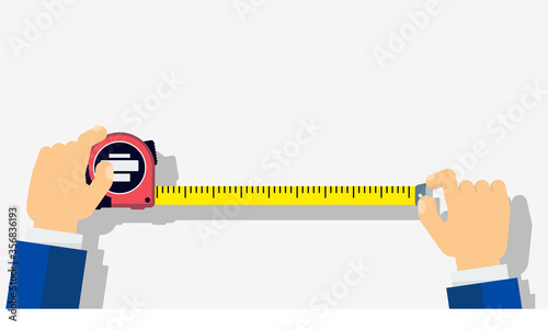 Measuring tape in the hands of a man.