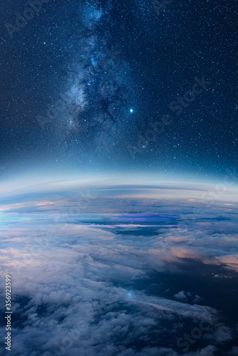 View of stars and milkyway above Earth from space