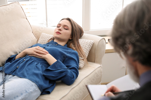 Psychotherapist and patient in office. Hypnotherapy session