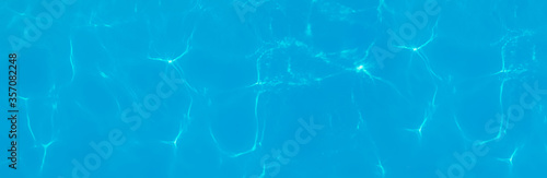 Swimming pool water as background, top view. Banner design