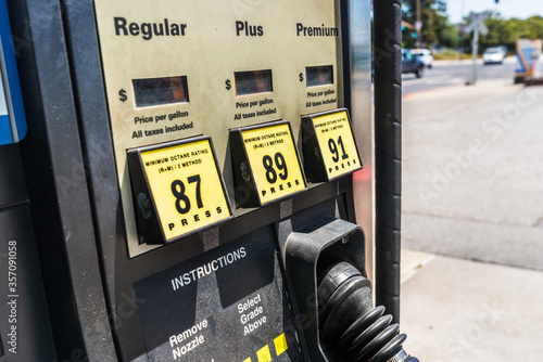 Close up of gas station pump; three octane grades available for selection; California, United States