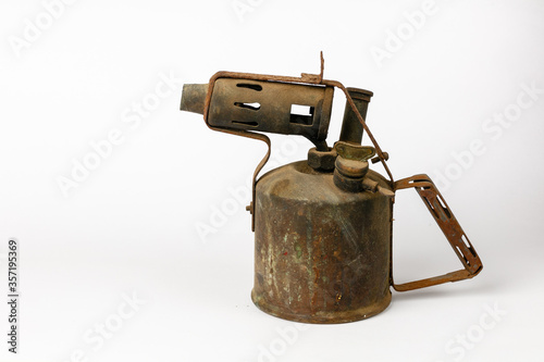 Old rusty blowtorch isolated on a white background