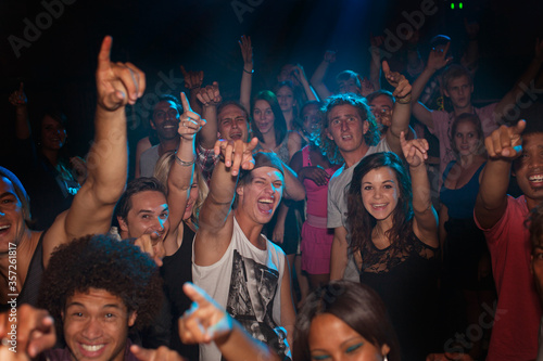 Enthusiastic crowd cheering at concert