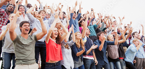 Cheering fans in crowd