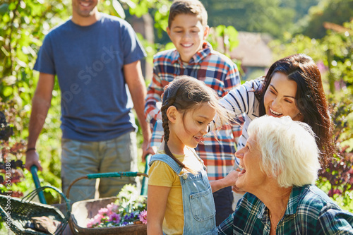 Multi-generation family bonding in sunny garden